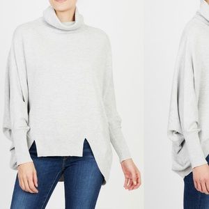 Turtleneck cape sweater